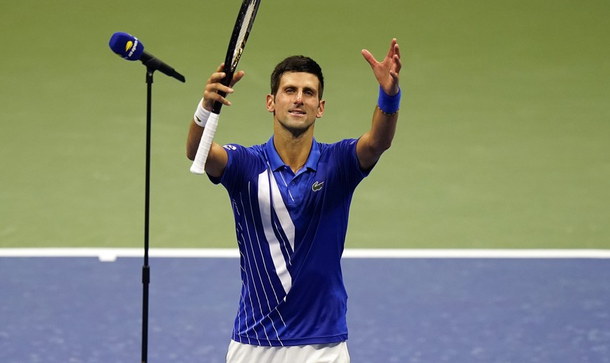 Novak Djokovic, of Serbia, reacts after defeating Damir Dzumhur, of Bosnia and Herzegovina, in the first round of the US Open tennis championships, Monday, Aug. 31, 2020, in New York. (AP Photo/Frank  ...