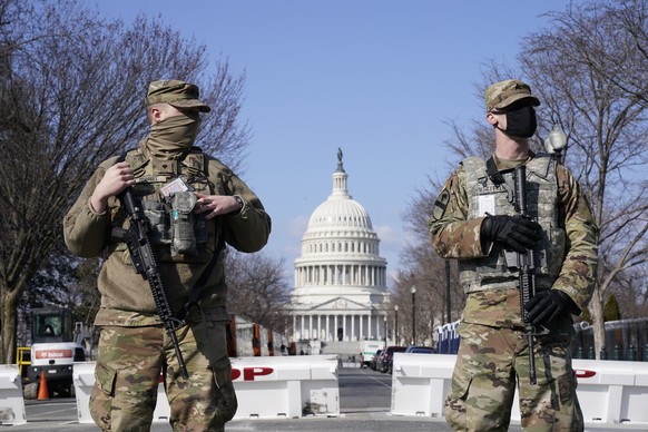 National Guard keep watch on the Capitol, Thursday, March 4, 2021, on Capitol Hill in Washington. Capitol Police say they have uncovered intelligence of a &quot;possible plot&quot; by a militia group  ...