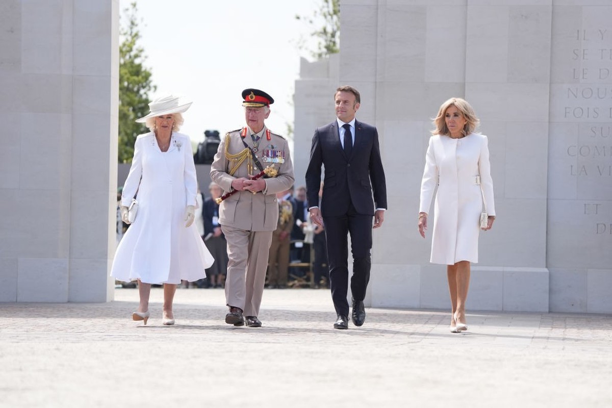 VER-SUR-MER, FRANCE - JUNE 6: King Charles III and Queen Camilla walk with France's President Emmanuel Macron (2nd R) his wife Brigitte Macron as they pass the memorial wall at the UK Ministry of ...