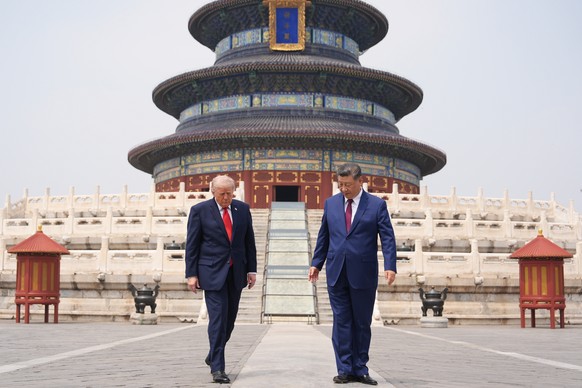 President Donald Trump, left, walks with Chinese President Xi Jinping at the Temple of Heaven on Thursday May 14, 2026, in Beijing. (AP Photo/Mark Schiefelbein)
APTOPIX Trump China