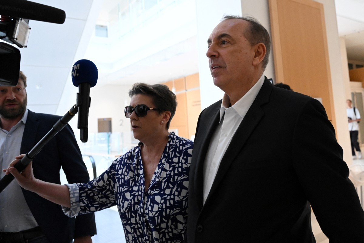 (FILES) French TV host Jean-Marc Morandini (R) arrives with his lawyer Florence Rault (C) at Paris courthouse for his trial on charges of "sexual harassment" and "undeclared work", ...