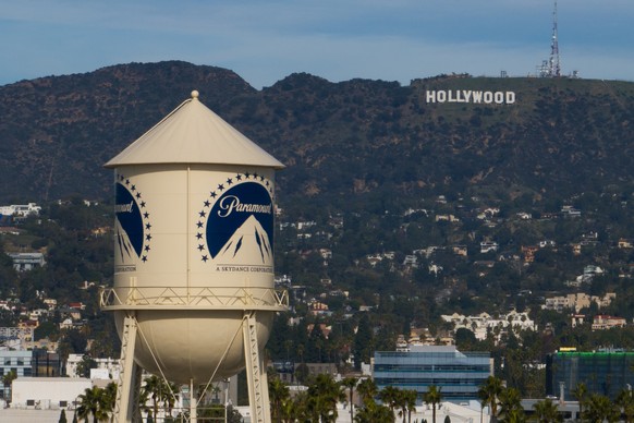 FILE - The Paramount Pictures water tower is seen in Los Angeles, Dec. 18, 2025, with the Hollywood sign in the distance. (AP Photo/Jae C. Hong, File)
Warner Bros