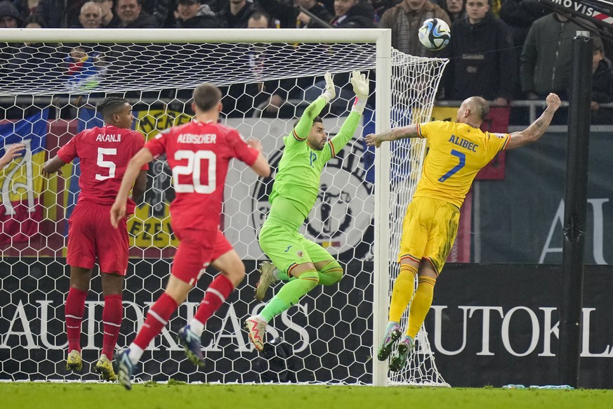 Romania&#039;s goalkeeper Horatiu Moldovan makes a save during the Euro 2024, group I, qualifying soccer match between Romania and Switzerland at the National Arena stadium in Bucharest, Romania, Tues ...