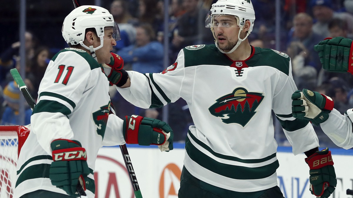 Minnesota Wild's Zach Parise, left, is congratulated by Nino Niederreiter, of Switzerland, after scoring during the third period of an NHL hockey game against the St. Louis Blues Tuesday, Feb. 6, ...