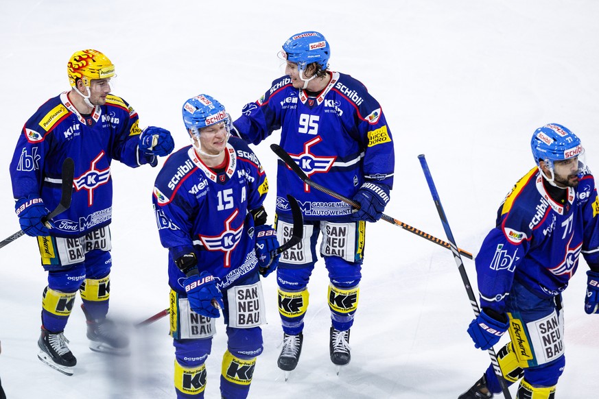 EHC Kloten PostFinance top scorer Axel Simic celebrated his goal into an empty net to make it 3-1 with defender Nicholas Steiner (#95), Stoermer Miro Aaltonen (#15) and defender Matteo Nodari (#77) during...