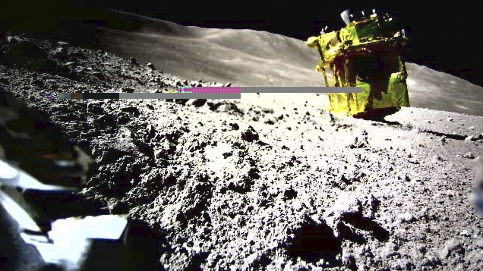 FILE - This image provided by the Japan Aerospace Exploration Agency (JAXA)/Takara Tomy/Sony Group Corporation/Doshisha University shows an image taken by a Lunar Excursion Vehicle 2 (LEV-2) of a robo ...