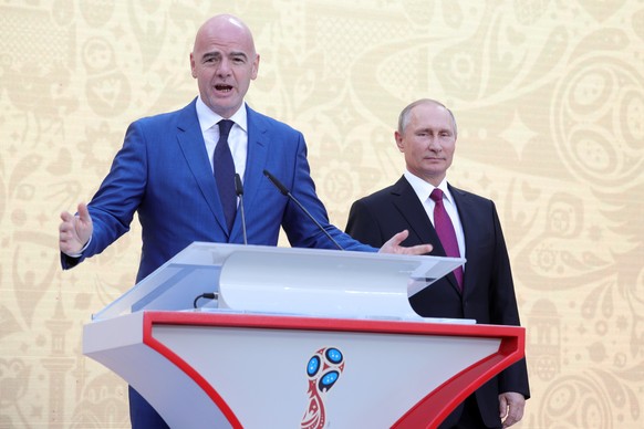 epa06194286 FIFA President Gianni Infantino (L) and Russian President Vladimir Putin (R) attend the FIFA World Cup Trophy Tour by Coca-Cola kick-off ceremony at the Luzhniki Stadium in Moscow, Russia, ...