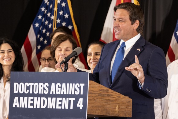 epa11673369 Florida Governor Ron DeSantis speaks during a press conference against Amendment 4 on Florida&#039;s first early voting day for the 2024 US presidential election in Miami, Florida, USA, 21 ...