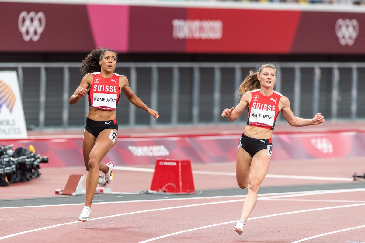 Ajla Del Ponte, right, and Mujinga Kambundji, left, finish the final of the women's 100 m in ranks five (Del Ponte) and six (Kambundji) at the 2020 Tokyo Summer Olympics Games in Tokyo, Japan, on ...