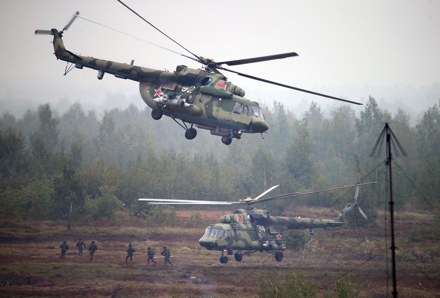 epa06215188 Belarussian helicopters and paratroopers in action during the joint Russia-Belarus strategic military exercises Zapad 2017, at the Borissov training range in Belarus, 20 September 2017. EP ...