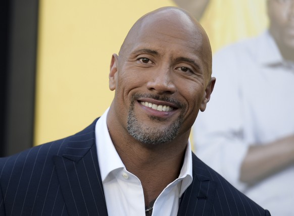 FILE - In this June 10, 2016 file photo, Dwayne Johnson attends the premiere of his film, &quot;Central Intelligence&quot; in Los Angeles. The AP reported on Sept. 8, 2017, that a story claiming Johns ...