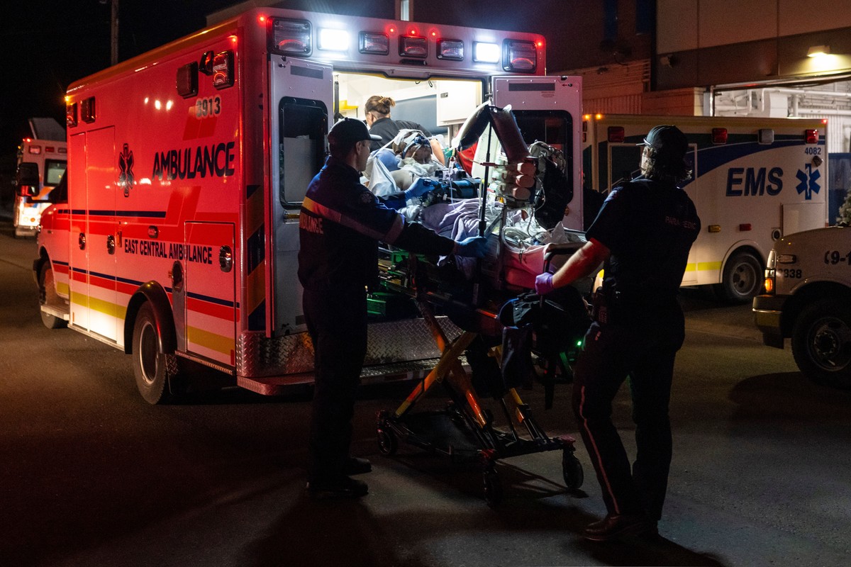 Paramedics load an injured person into an ambulance at the Wainwright Health Centre as injured military members are treated after a fire at Canadian Forces Base Wainwright, outside of Wainwright, Albe ...