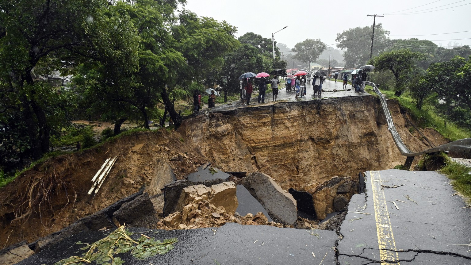 A road connecting the two cities of Blantyre and Lilongwe is seen damaged following heavy rains caused by Tropical Cyclone Freddy in Blantyre, Malawi Tuesday, March 14 2023. (AP Photo/Thoko Chikondi)