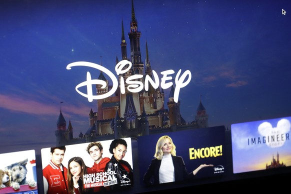 FILE - In this Wednesday, Nov. 13, 2019, file photo, a Disney logo forms part of a menu for the Disney Plus movie and entertainment streaming service on a computer screen in Walpole, Mass. Streaming s ...