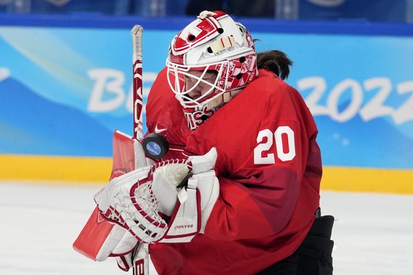 Switzerland goalkeeper Andrea Braendli (20) blocks a shot against the United States during a preliminary round women&#039;s hockey game at the 2022 Winter Olympics, Sunday, Feb. 6, 2022, in Beijing. ( ...