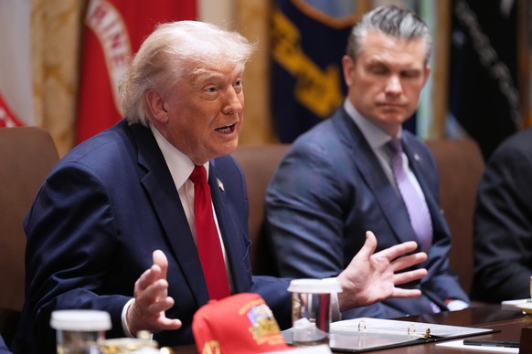 President Donald Trump speaks during a Cabinet meeting at the White House, Wednesday, May 27, 2026, in Washington, as Secretary of Defense Pete Hegseth, looks on. (AP Photo/Jacquelyn Martin)
Donald Tr ...