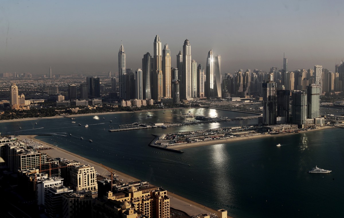 FILE - Luxury towers that dominate the skyline in the Dubai Marina district, center, and the new Dubai Harbor development, right, are seen from the observation deck of "The View at The Palm Jumei ...
