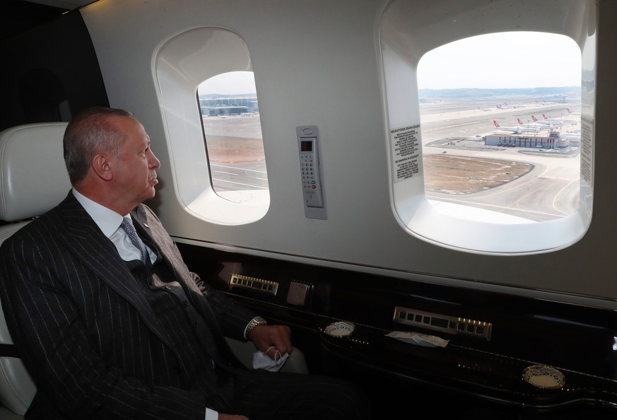 epa08485069 A handout photo made available by the Turkish President Press office shows Turkish President Recep Tayyip Erdogan looks from window of his helicopter before an opening ceremony of Istanbul ...