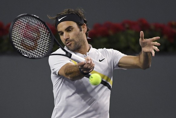 Roger Federer, of Switzerland, returns a shot against Chung Hyeon, of South Korea, during the quarterfinals at the BNP Paribas Open tennis tournament Thursday, March 15, 2018, in Indian Wells, Calif.  ...