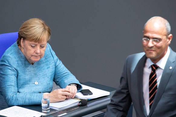 epa07011939 German Chancellor Angela Merkel reacts as Peter Boehringer of the Alternative for Germany party (AfD) returns his seat after his speech during a session of the German parliament &#039;Bund ...