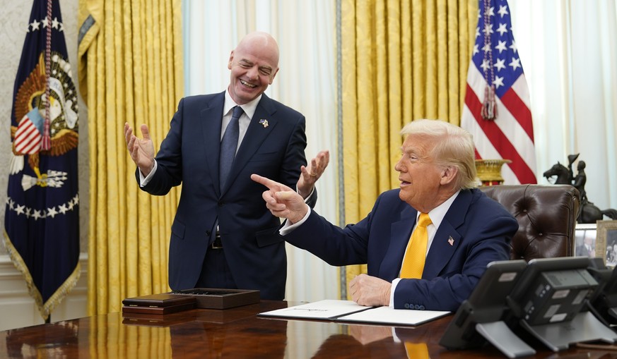 KEYPIX - epa11947882 FIFA President Gianni Infantino (L) makes remarks as he meets United States President Donald J Trump who will sign an Executive Order setting up a task force on the World Cup in t ...