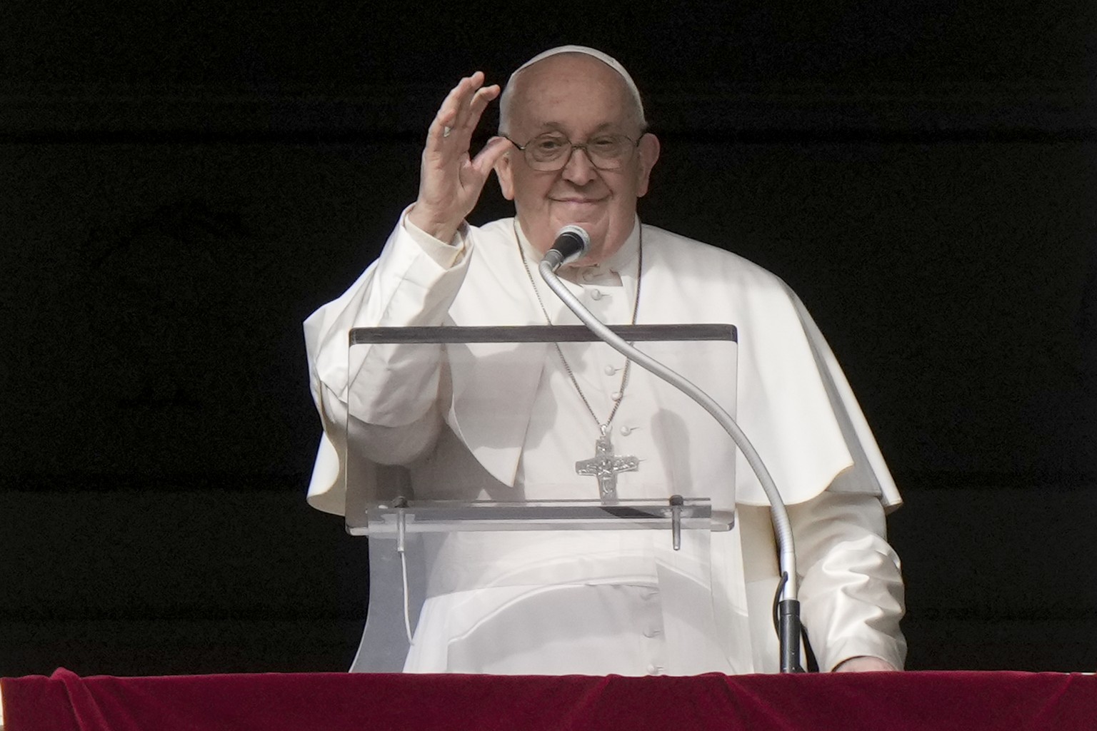 Pope Francis delivers his blessing as he recites the Angelus noon prayer from the window of his studio overlooking St.Peter&#039;s Square, at the Vatican, Monday, Jan. 1, 2024. (AP Photo/Andrew Medich ...