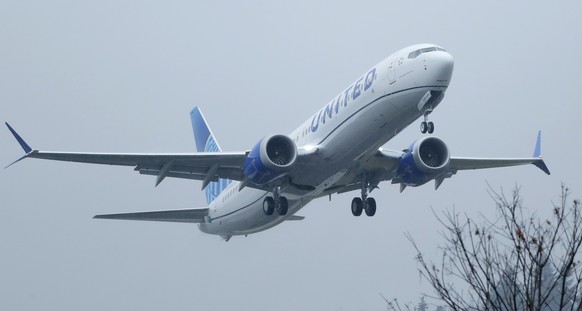 FILE - In this Wednesday, Dec. 11, 2019, file photo, a United Airlines Boeing 737 Max airplane takes off in the rain, at Renton Municipal Airport in Renton, Wash. Federal auditors are issuing fresh cr ...