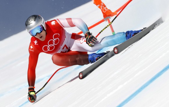 epa09734606 Marco Odermatt of Switzerland in action during the Men&#039;s Downhill race of the Alpine Skiing events of the Beijing 2022 Olympic Games at the Yanqing National Alpine Ski Centre Skiing,  ...