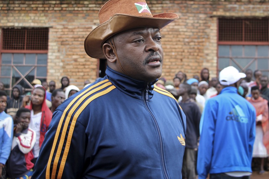 FILE - In this Thursday, May 17, 2018 file photo, Burundi&#039;s President Pierre Nkurunziza speaks to the media after casting his vote in the constitutional referendum in Buye, northern Burundi. Buru ...