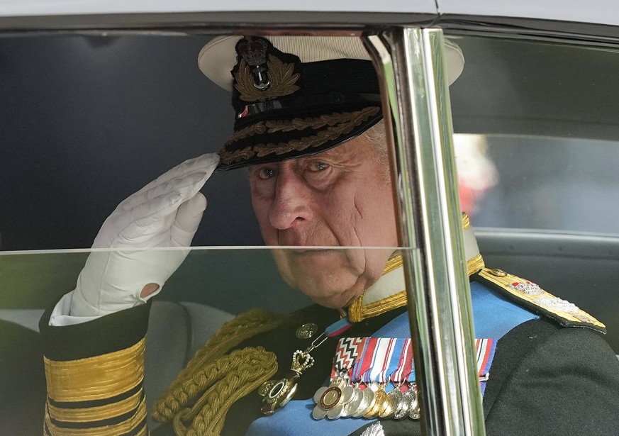 FILE - King Charles III salutes as he leaves Westminster Abbey following the state funeral service of Queen Elizabeth II in Westminster Abbey in central London, England, Monday Sept. 19, 2022.After wa ...