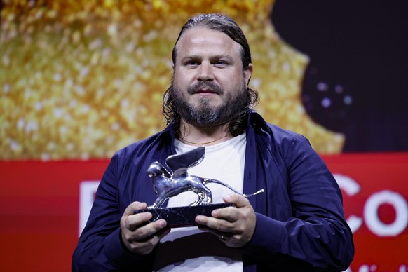 epa11592031 US director Brady Corbet holds the Silver Lion for Best Director for &#039;The Brutalist&#039; during the closing ceremony of the 81st annual Venice International Film Festival, in Venice, ...