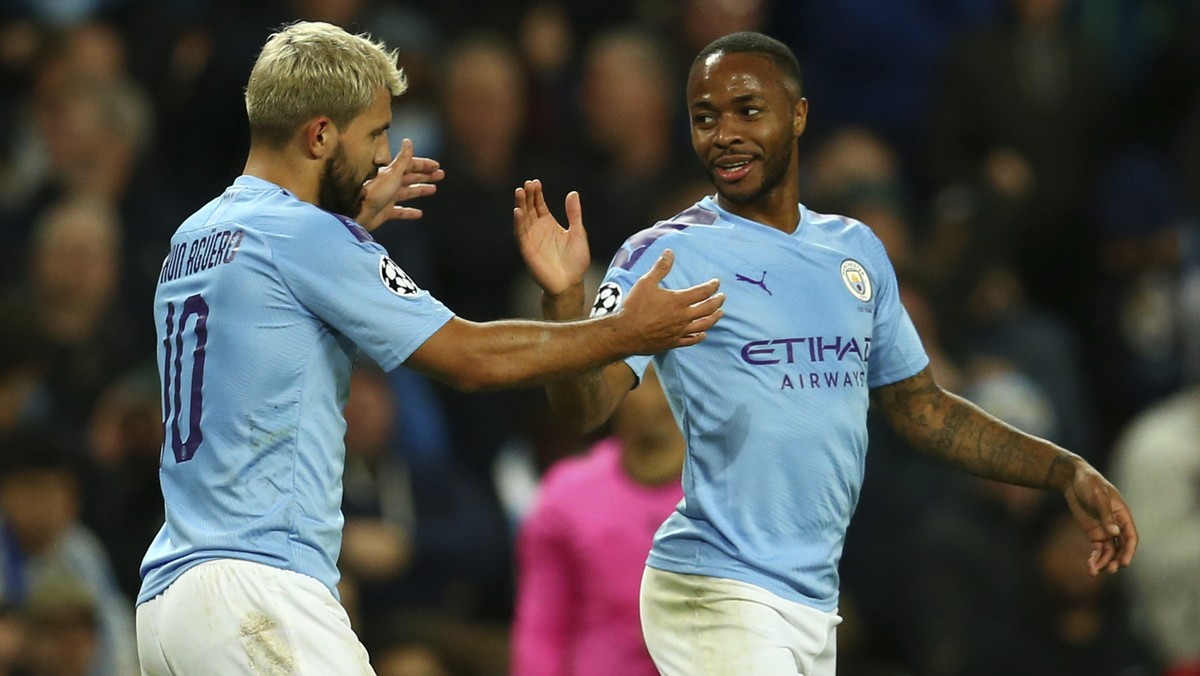 Manchester City's Raheem Sterling, left, celebrates with his teammate Sergio Aguero after scoring his side's fifth goal, during the group C Champions League soccer match between Manchester C ...