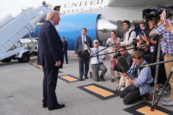 President Donald Trump talks to reporters before he boards Air Force One at Palm Beach International Airport in West Palm Beach, Fla., Saturday May 2, 2026, en route Miami. (AP Photo/Matt Rourke)
Dona ...
