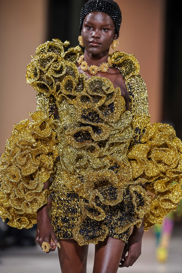 epa11864255 A model presents a creation from the Spring/Summer 2025 Haute Couture collection of Swiss designer Kevin Germanier during Paris Fashion Week, in Paris, France, 30 January 2025. EPA/CHRISTO ...