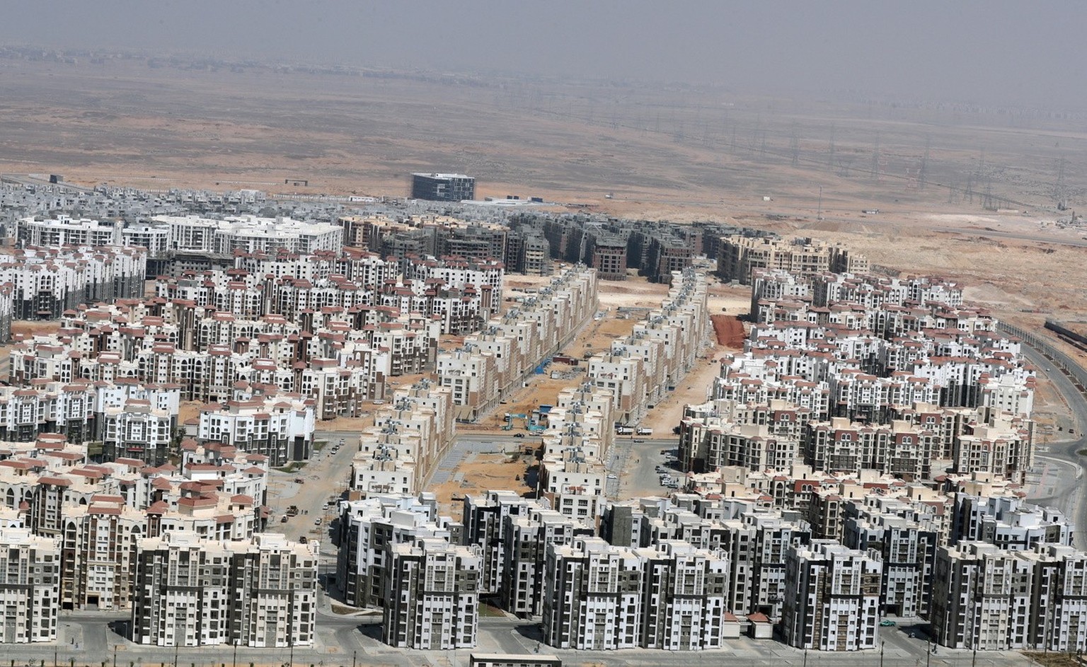 epa09078531 View of a construction site of the new administrative capital, 45 kilometers east of Cairo, Egypt, March 16, 2021. Egypt has started construction of the new administrative and financial capi...