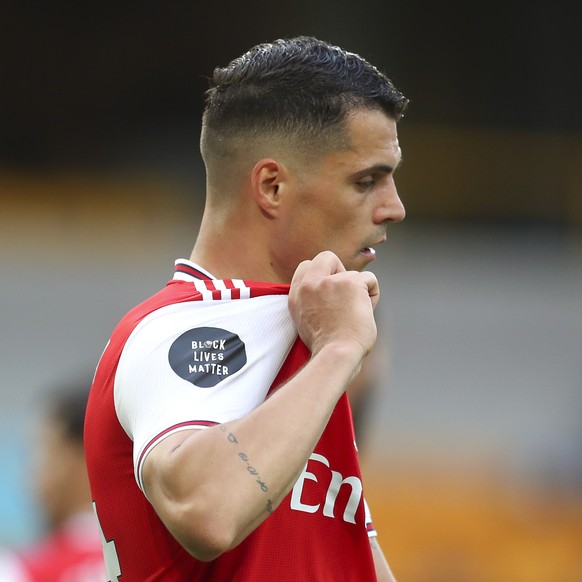 epa08527358 Granit Xhaka of Arsenal reacts during the English Premier League match between Wolverhampton Wanderers and Arsenal London in Wolverhampton, Britain, 04 July 2020. EPA/Cath Ivill/NMC/Pool E ...