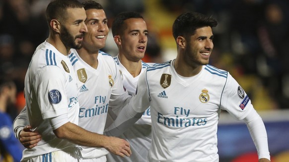 Real Madrid&#039;s Cristiano Ronaldo, second left, celebrates after scoring the fifth goal of his team during the Champions League Group H soccer match between APOEL Nicosia and Real Madrid at GSP sta ...