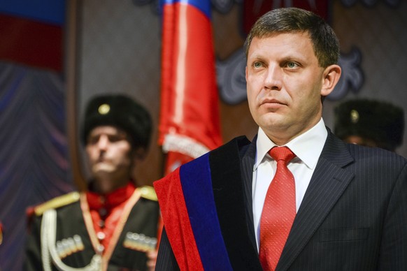 FILE - In this Tuesday, Nov. 4, 2014 file photo, rebel leader Alexander Zakharchenko stands during a swearing in ceremony in Donetsk, Ukraine. The news agency of the Russia-backed separatists fighting ...