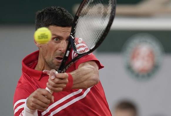 Serbia&#039;s Novak Djokovic plays a return to United States&#039;s Tennys Sandgren during their first round match on day three of the French Open tennis tournament at Roland Garros in Paris, France,  ...