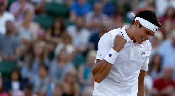 epa06079886 Milos Raonic of Canada celebrates winning against Alexander Zverev of Germany during their fourth round match for the Wimbledon Championships at the All England Lawn Tennis Club, in London ...