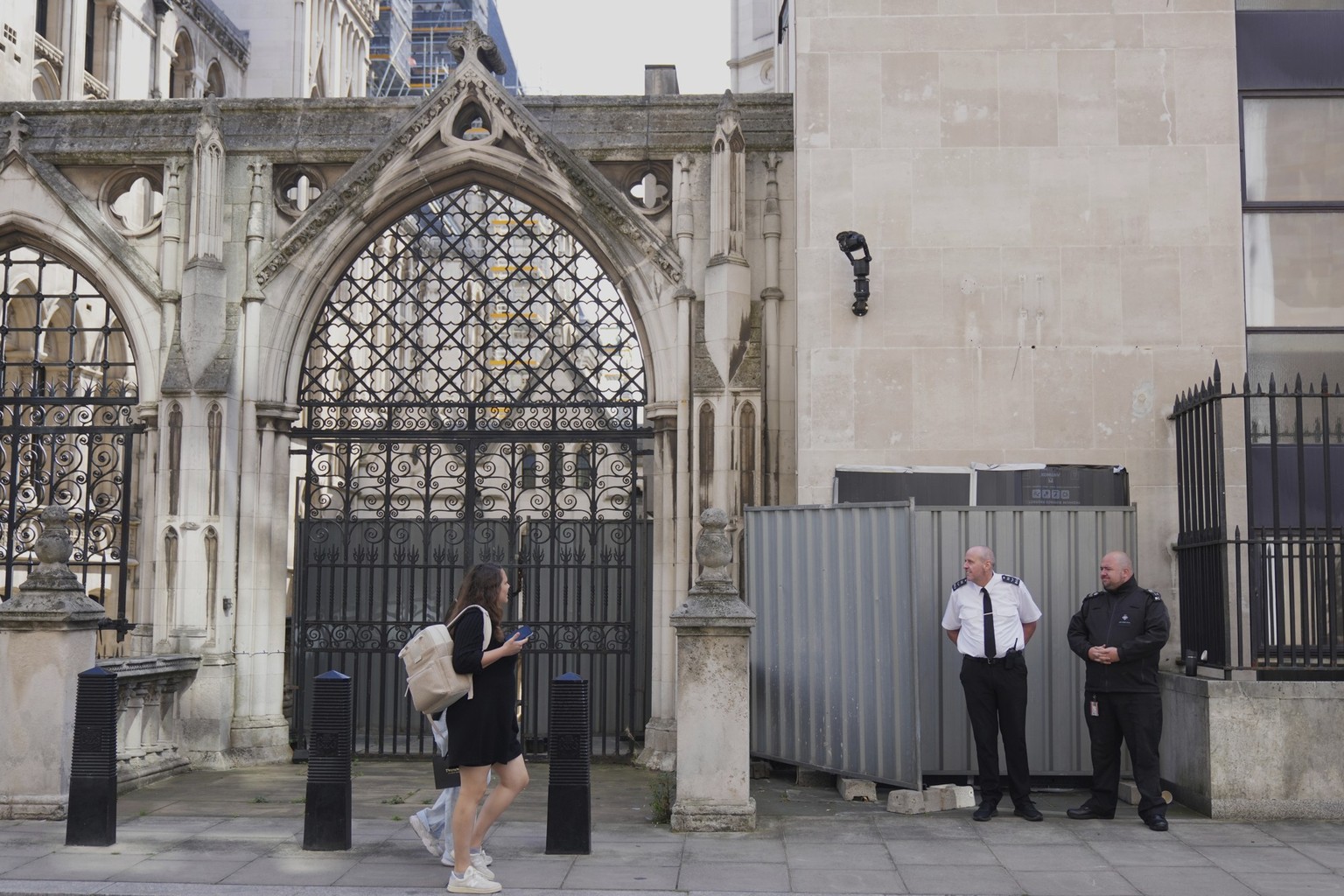 Banksy's latest artwork appears outside at the Royal Courts of Justice in London, which shows a judge using his gavel to strike a protester who is lying on the ground holding a placard has been c ...