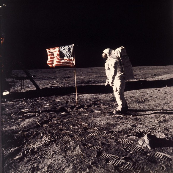 FILE - In this July 20, 1969 file photo provided by NASA shows astronaut Edwin E. &quot;Buzz&quot; Aldrin Jr. posing for a photograph beside the U.S. flag deployed on the moon during the Apollo 11 mis ...