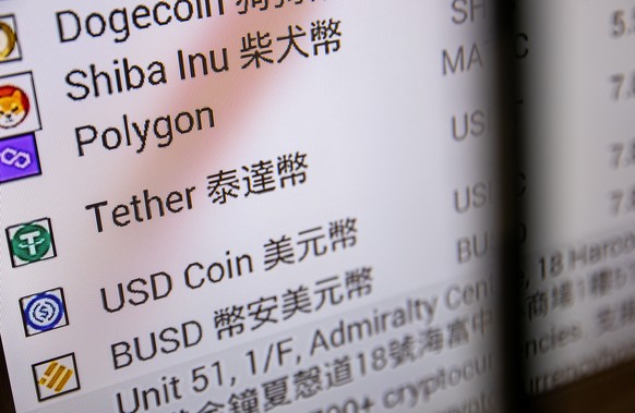 epa09968512 A monitor displays the rates of Tether and other cryptocurrencies in Hong Kong, China, 23 May 2022. Tether, a stable coin cryptocurrency, has come under scrutiny after the recent crashes o ...