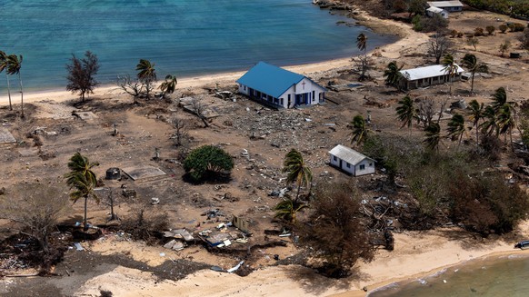 epa09732087 A handout photo made available by the Australian Government Department of Defence (DoD) shows damage at Atata Island, in Tonga, 28 January 2022 (issued 06 January 2022), following the erup ...