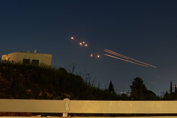 240412 -- HULA VALLEY, April 12, 2024 -- Israel s Iron Dome defense system launches missiles to intercept rockets fired from Lebanon, as seen over Hula Valley, northern Israel, on April 12, 2024. Abou ...