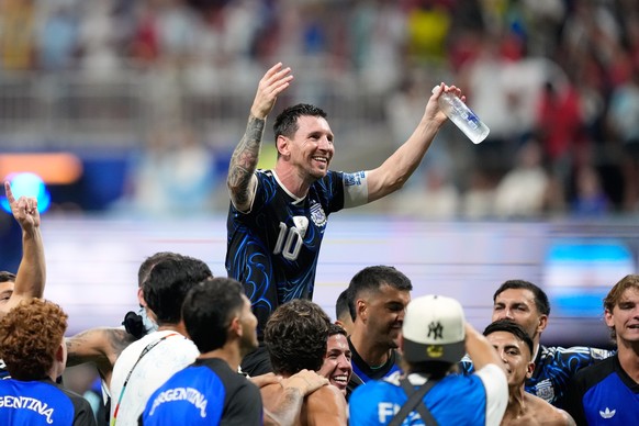 Argentina's Lionel Messi celebrates with his teammates at the end of the World Cup semifinal soccer match between England and Argentina in Atlanta, Wednesday, July 15, 2026. (AP Photo/Rebecca Bla ...