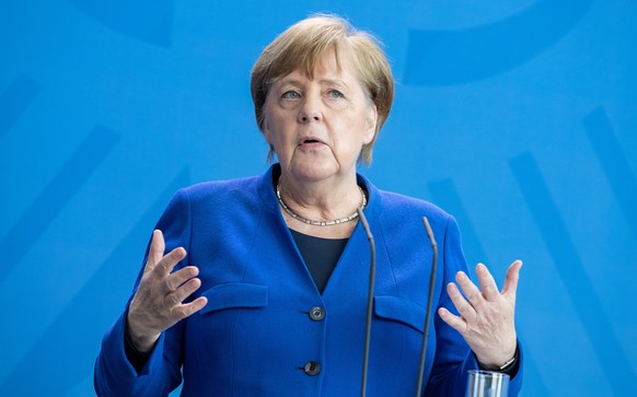 epa08373382 German Chancellor Angela Merkel gives a statement after a Corona Cabinet Meeting in Berlin, Germany, 20 April 2020. Countries around the world are taking increased measures to stem the wid ...