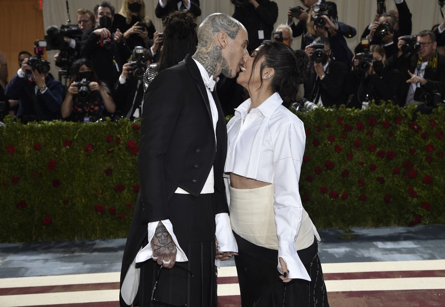 Travis Barker, left, and Kourtney Kardashian attend The Metropolitan Museum of Art's Costume Institute benefit gala celebrating the opening of the "In America: An Anthology of Fashion" ...