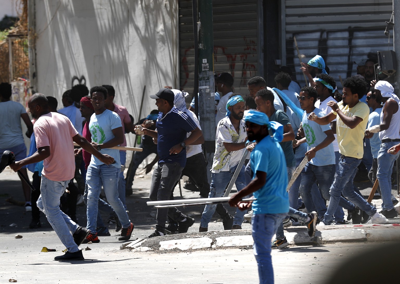 epa10835529 Opponents of the Eritrean regime move in a street during a protest against a pro-regime conference followed by clashes with Israeli police, in Tel Aviv, Israel, 02 September 2023. The prot ...