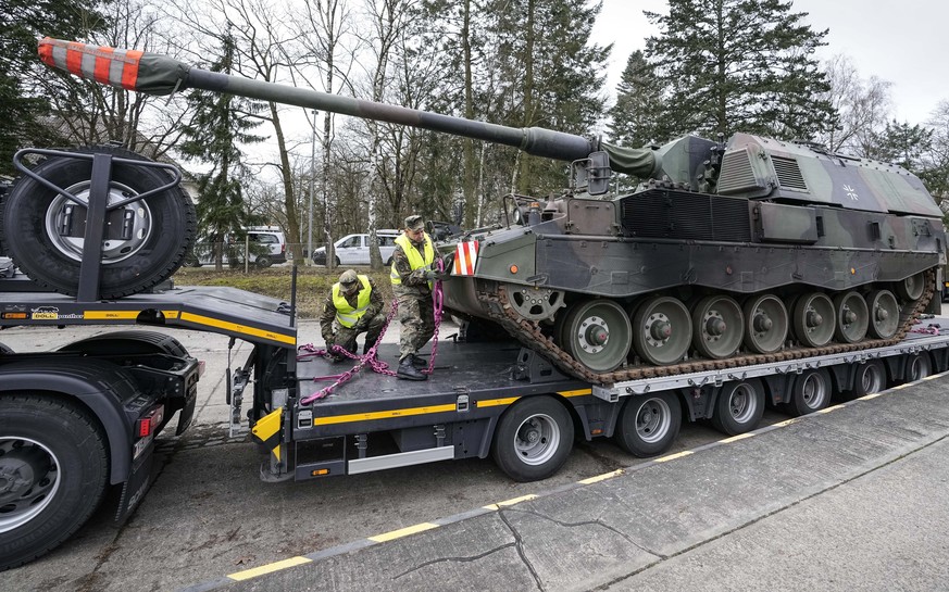 FILE - German soldiers load tank howitzers 2000 for transport to Lithuania at the Bundeswehr army base in Munster, northern Germany, Monday, Feb. 14, 2022. Germany's defense minister confirmed Friday  ...
